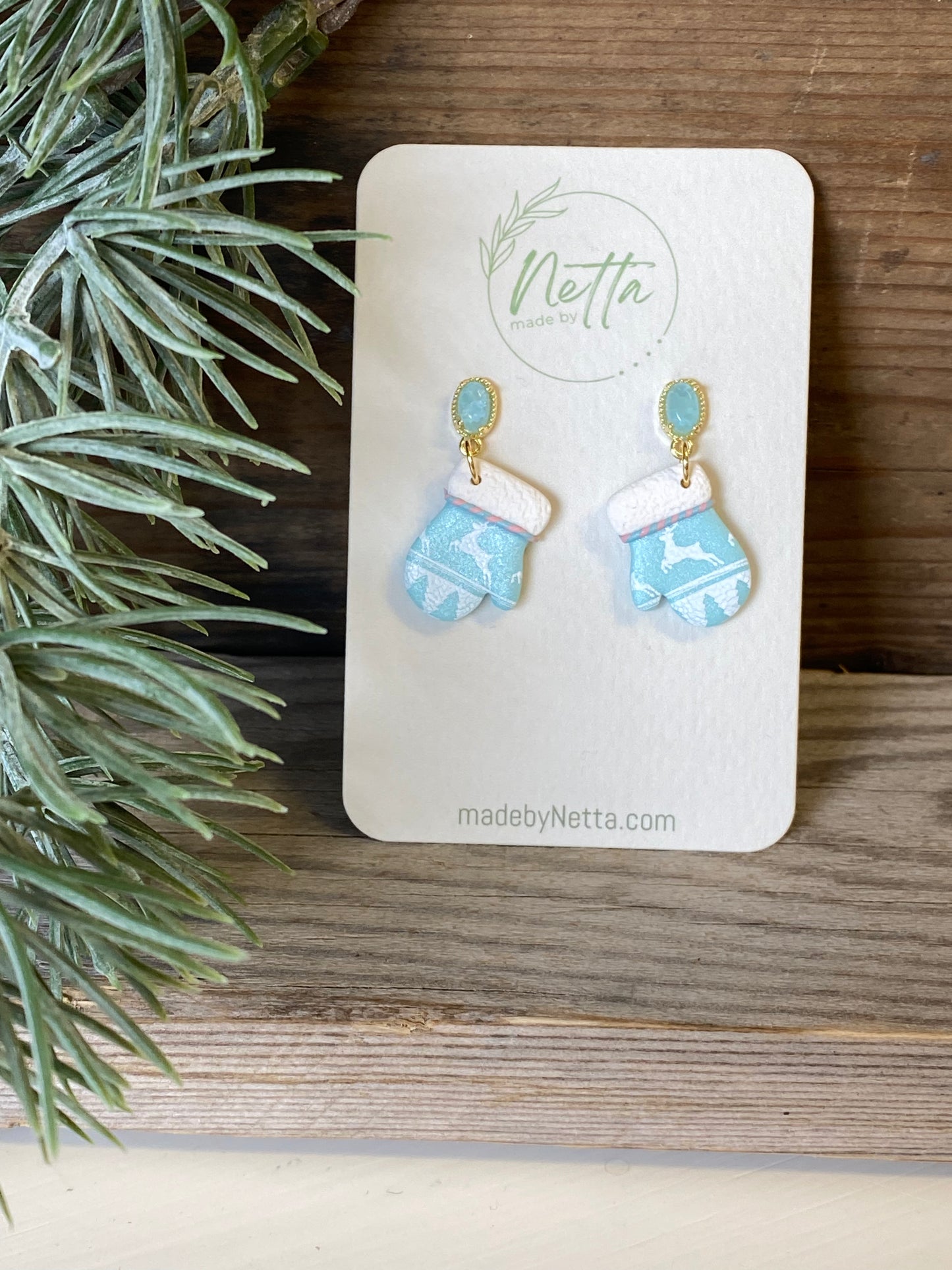 Blå votter med reinsdyr